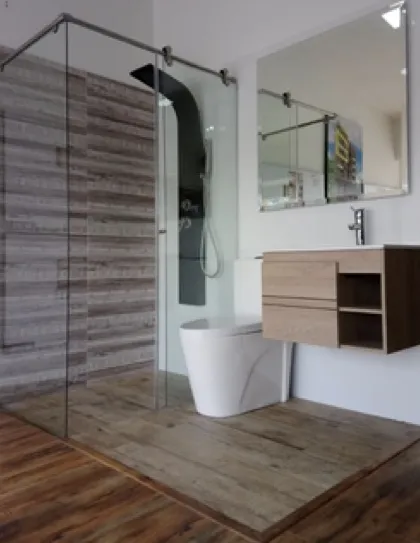 Render de baño con ducha en vidrio y mueble flotante